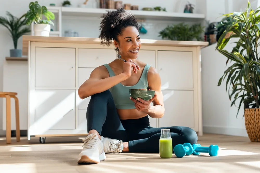 A woman following a training session at home