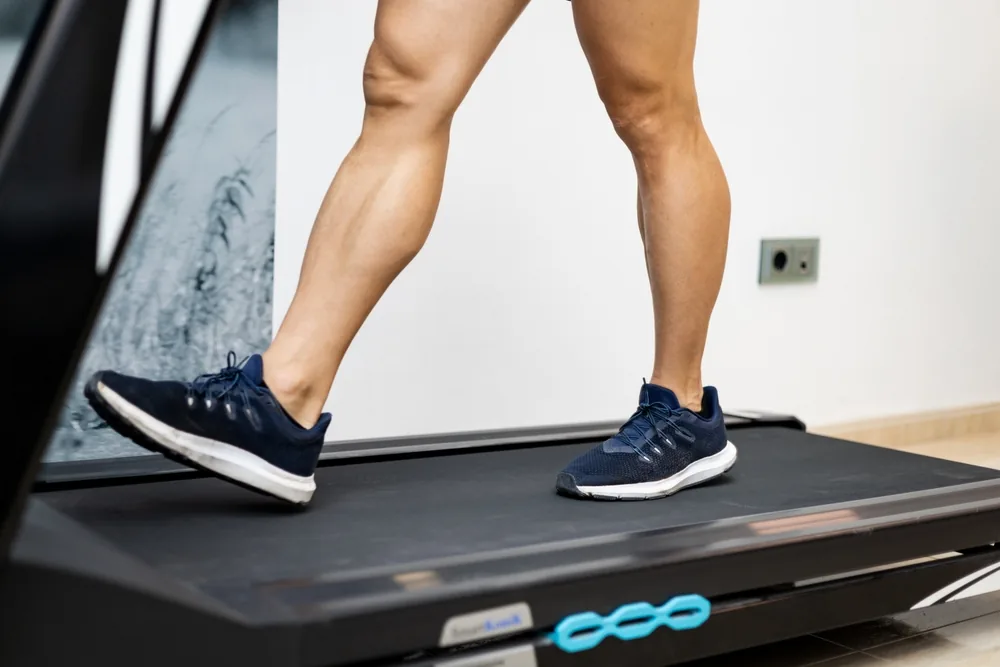 A runner's legs on a treadmill during a gait assessment